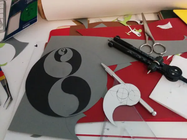 Making a yin yang with coloured papers and stuff